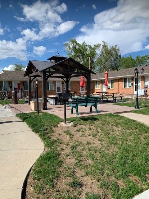 Pavilion and open lawn with patio umbrellas